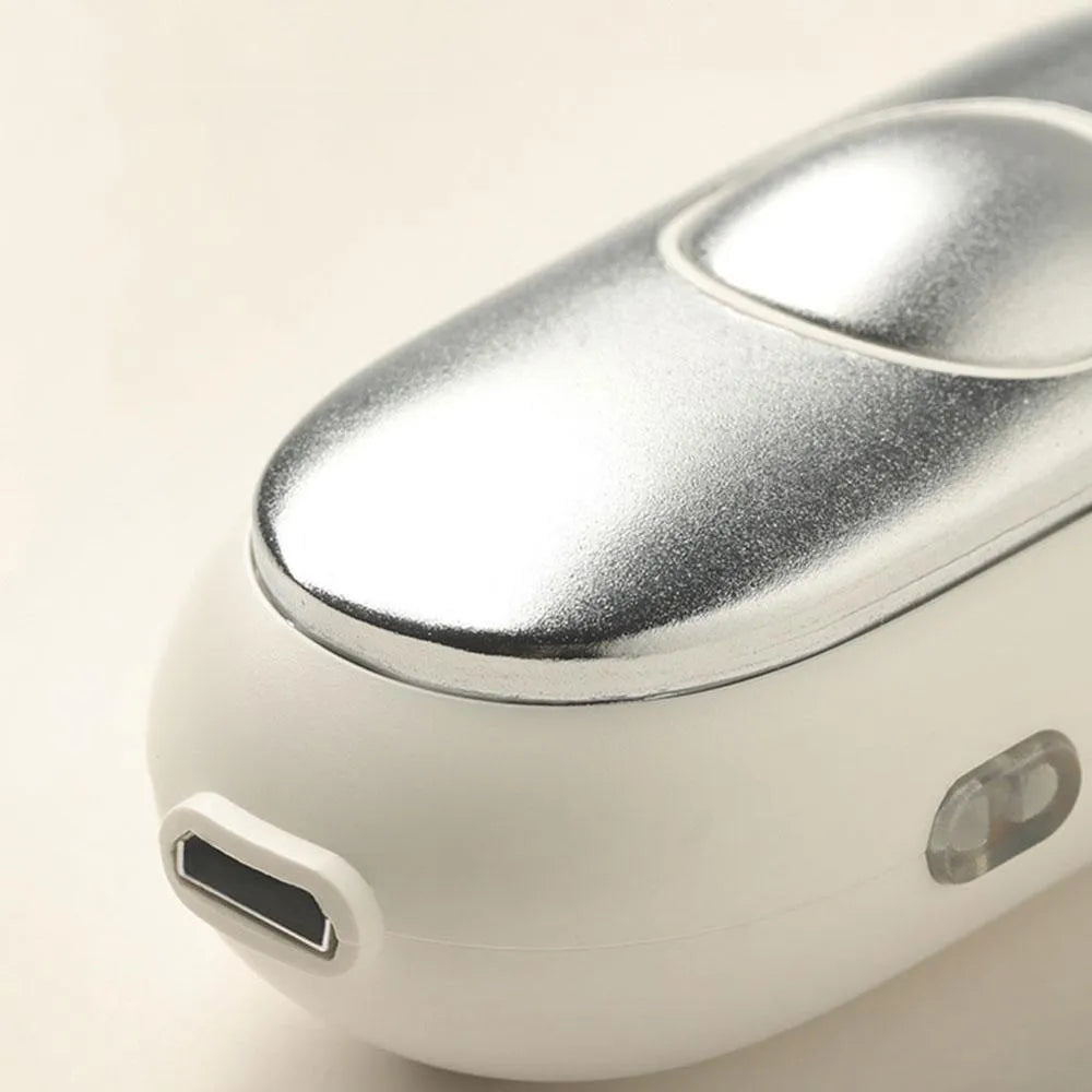 Hand-held micro-current sleep aid device with round button and USB charging port