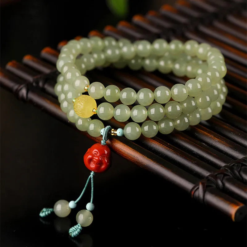 Pale blue Hetian jade bracelet with three circles of 6mm beads on a wrist.