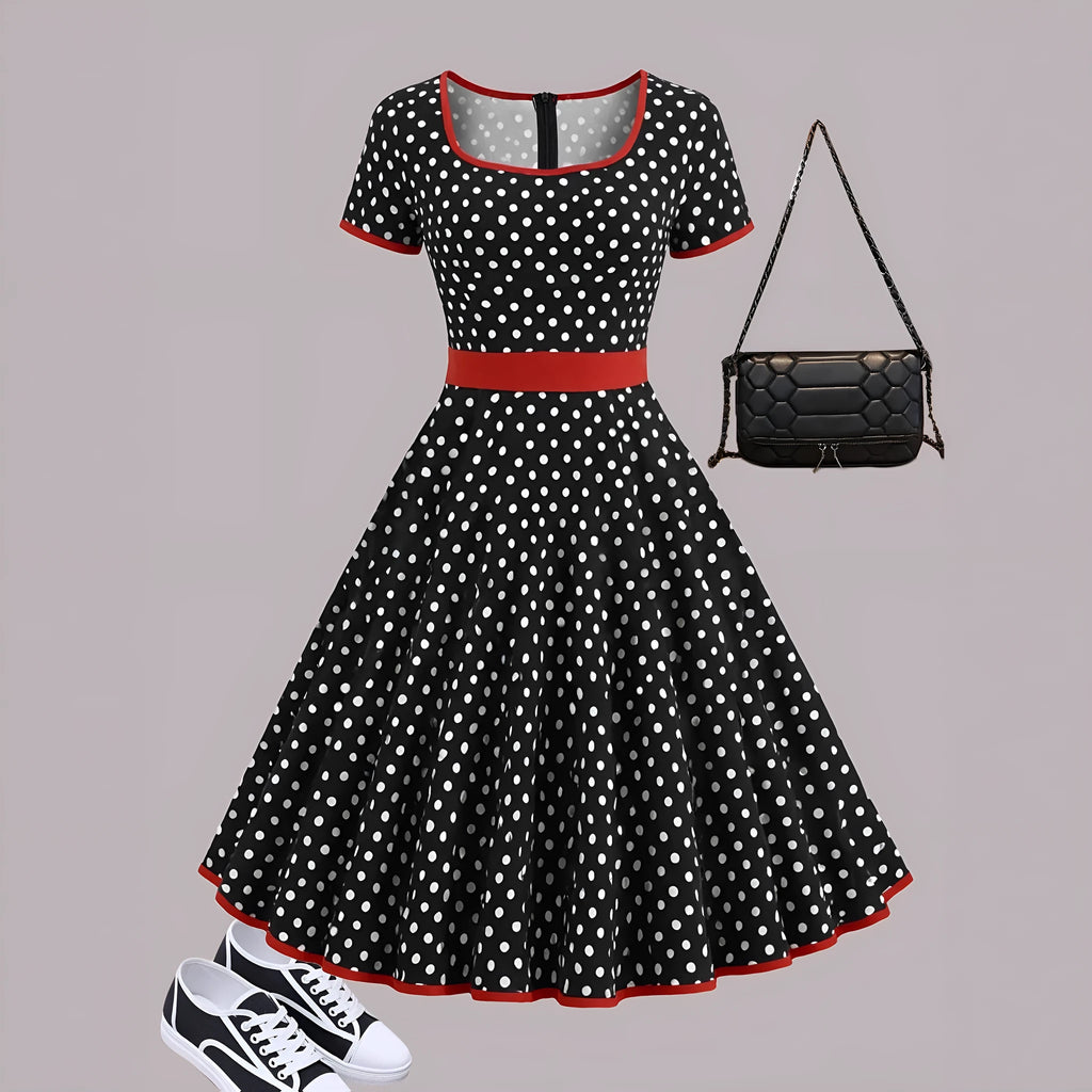 Multicolour polka dot dress with a square neckline, short sleeves, front zipper, and a pleated midi skirt on a hanger.