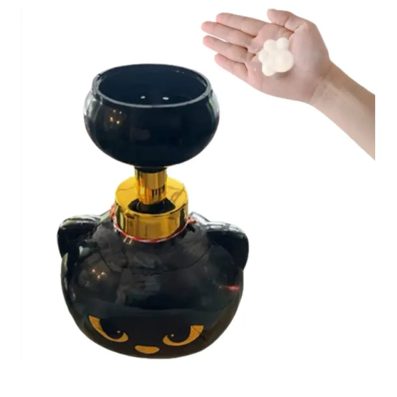 Black cartoon cat-shaped plastic foam soap dispenser pump, 10cm wide by 18cm tall.