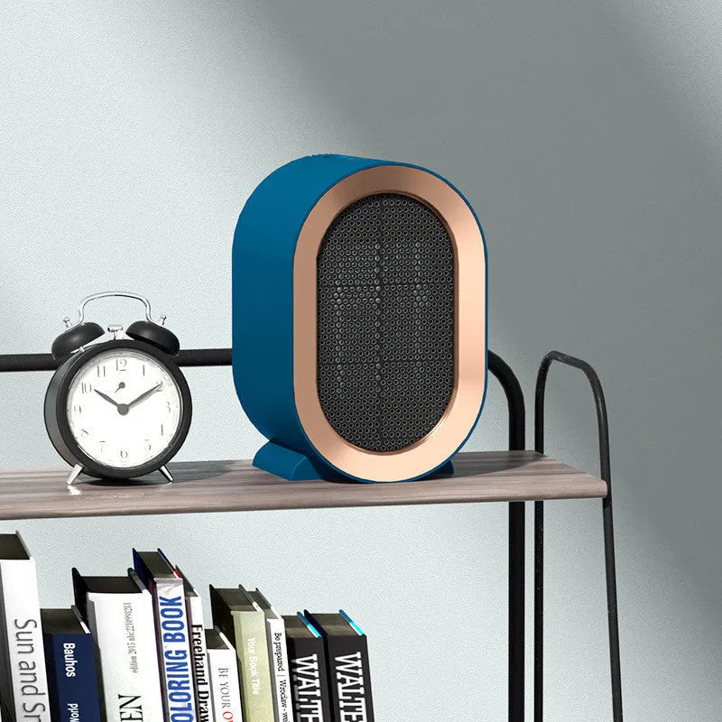 Compact desktop ceramic fan heater in a choice of colours with mechanical control dial.
