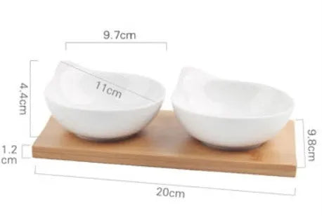 Porcelain ceramic dried fruit dish with compartments on wooden serving board