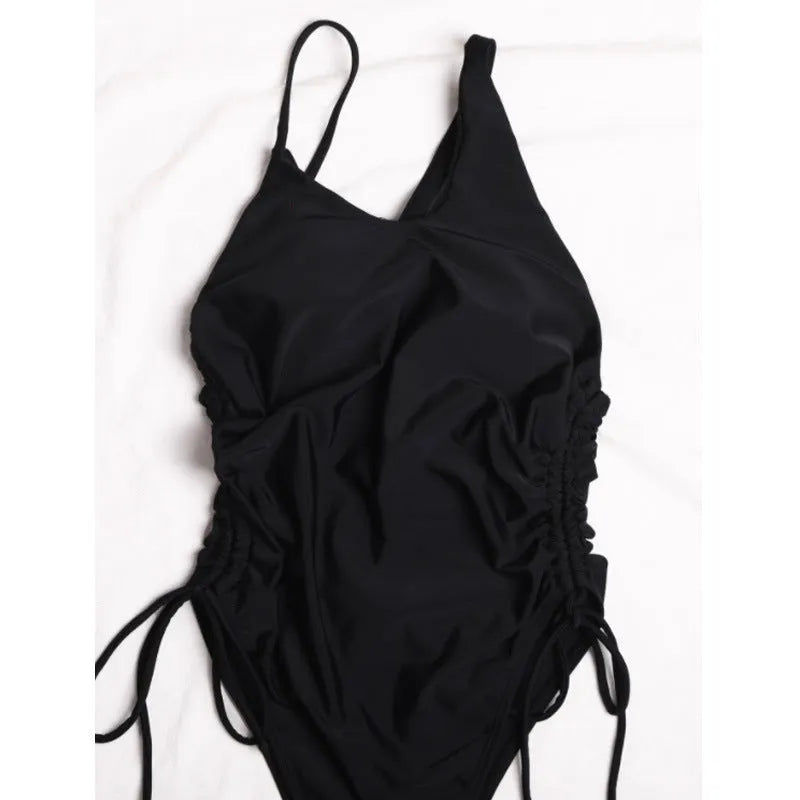 Black women's dress with sloping shoulder lacing detailing, sleeveless tight fit design