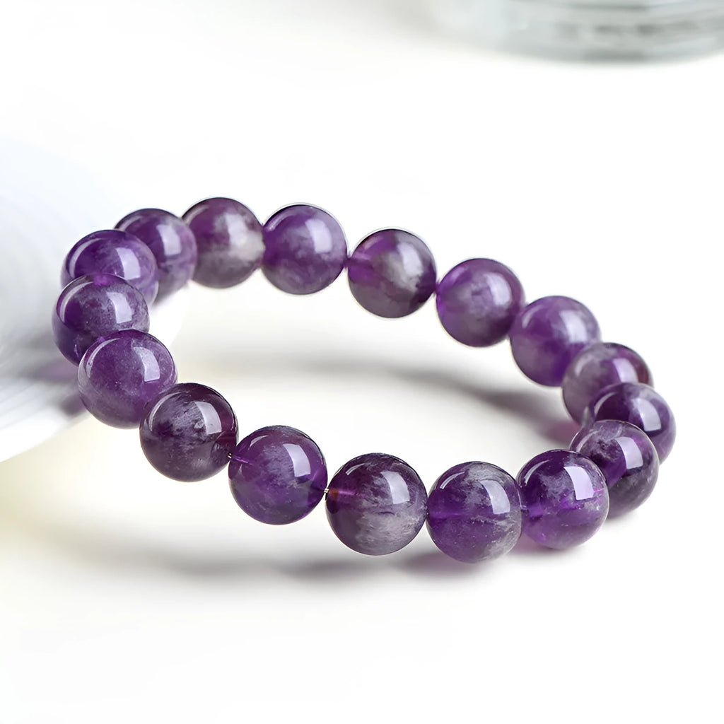 Feather amethyst crystal bracelet in Snow Mountain purple with scattered Ruyi geometry beads.