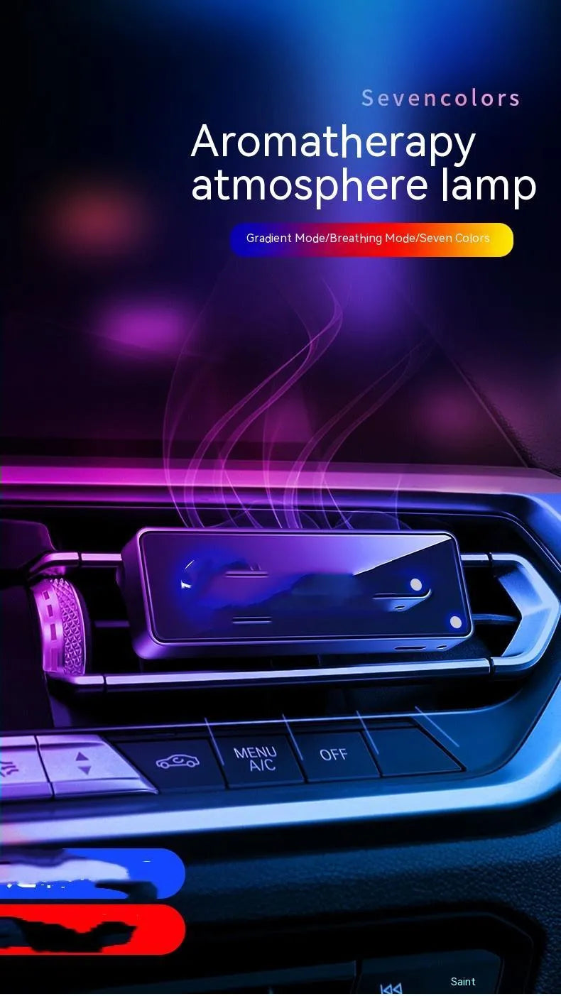 Black car air vent perfume diffuser with LED mood light mounted on vehicle ventilation louvre