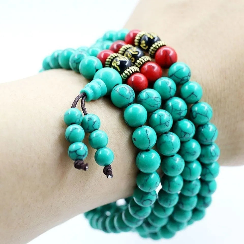 Multi-layer turquoise and synthetic stone 108 beads bracelet with round polished beads.