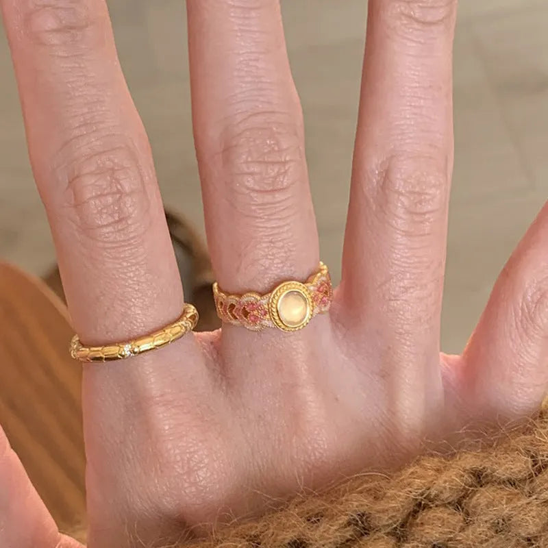 Geometric open mouth ring with pink crystal enamel detailing on copper gold plated band