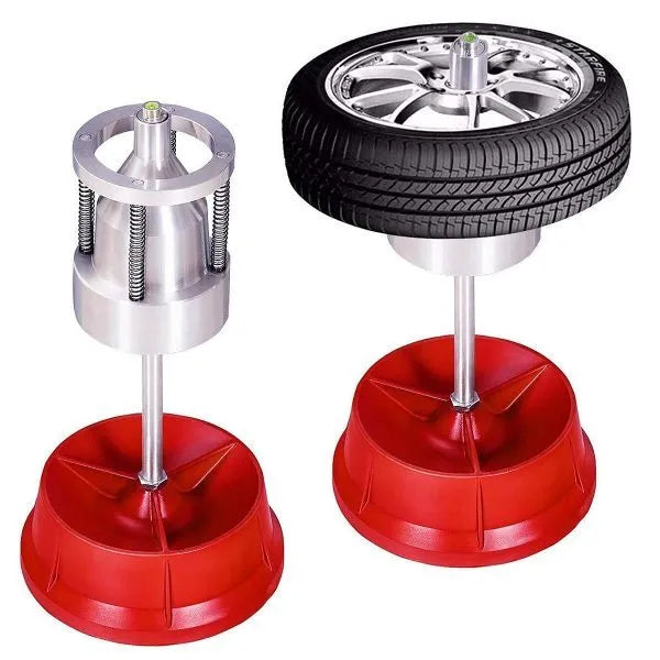 Portable wheel hub balancer with aluminium head and bull's eye level on an enamel base.