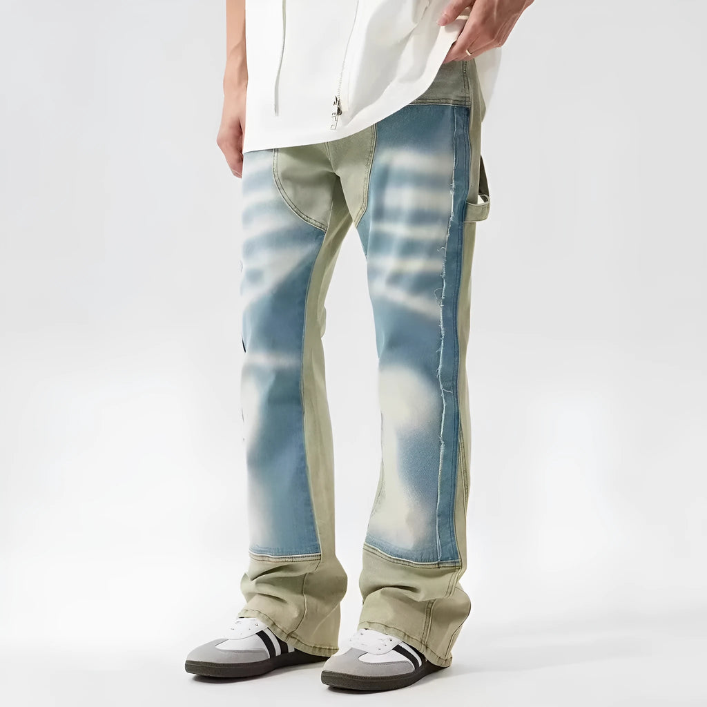 Yellow and blue retro patchwork jeans with splash-ink and distressed detailing on a mid-rise denim fit