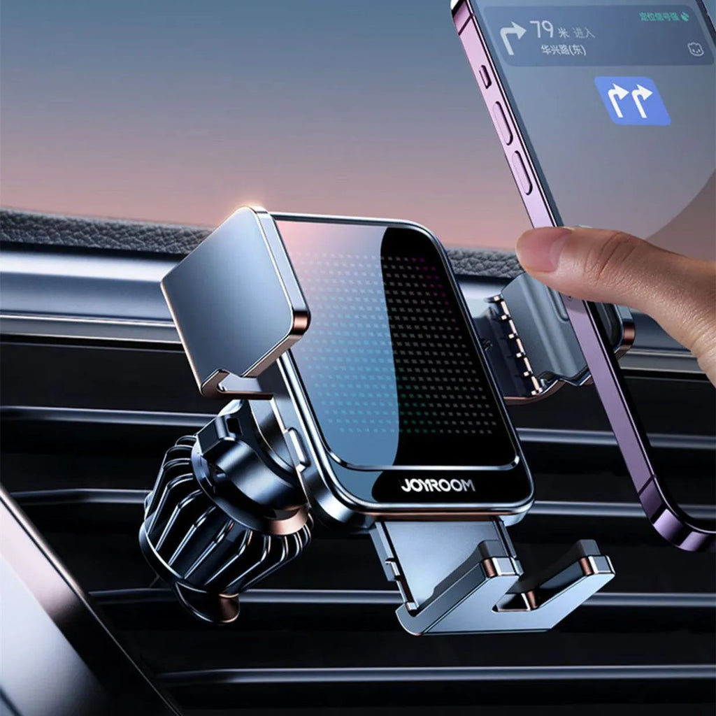 Black car wireless charging bracket mounted on air vent, showing phone being placed on automatic holder.