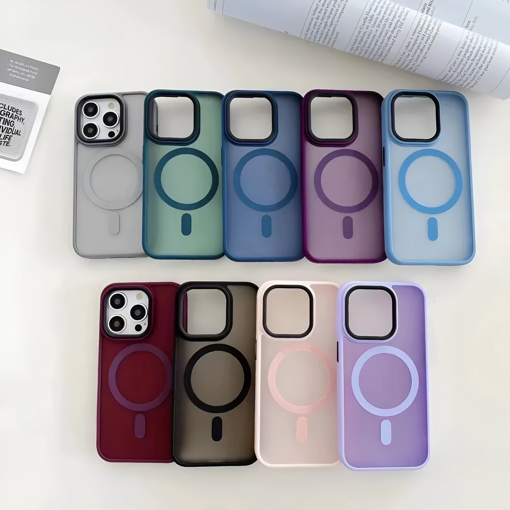 Frosted magnetic suction hard case for Apple iPhone 16 in dark purple colour on a table.
