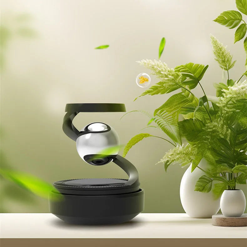 Solar-powered car hanging ornament in Gulong or Ocean colour, 65mm by 81mm.
