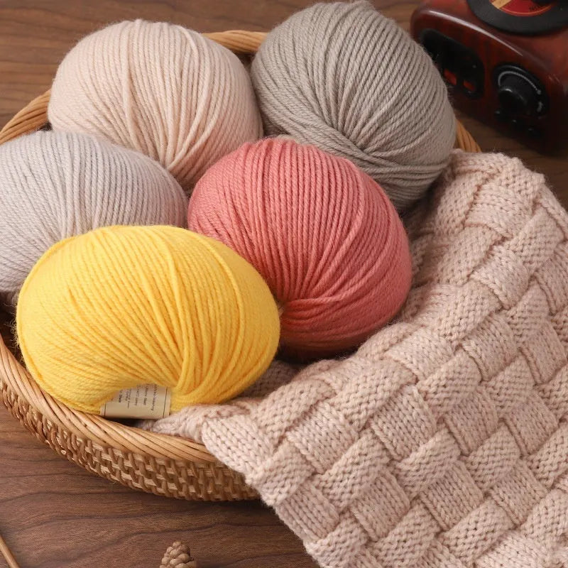 Roll of hand-knitting wool thread in various colours for scarf and sweater projects.