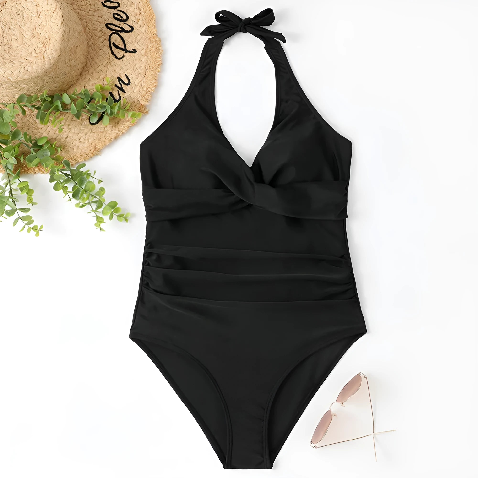 Women's solid colour one-piece swimsuit with cross-back straps on a mannequin.