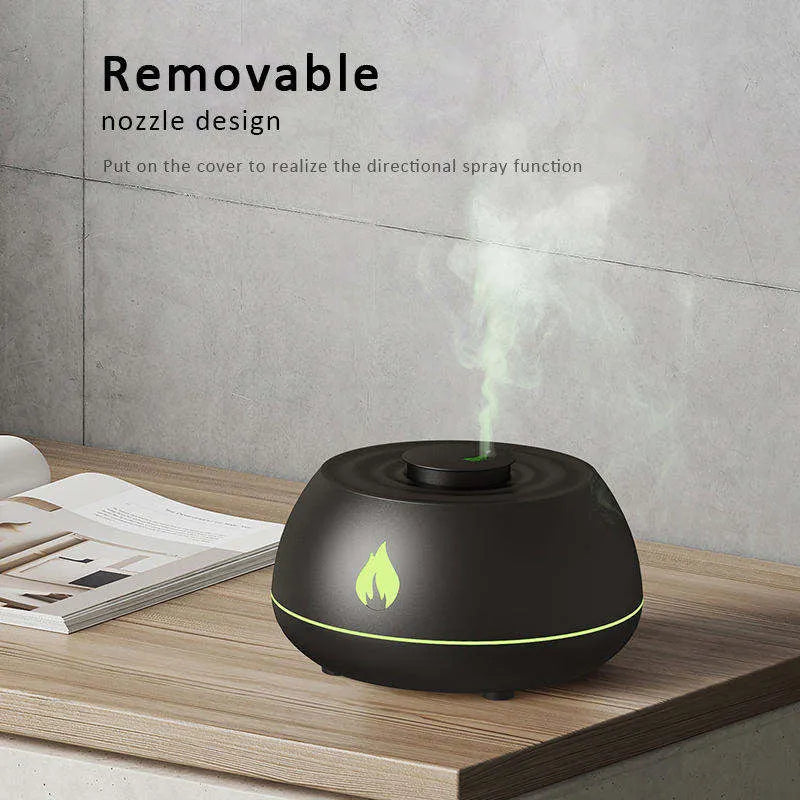 Black and white USB humidifier diffuser with glowing flame effect light on a wooden table.