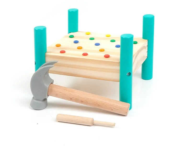 Wooden knock table with 17 colourful nails, hammer and reverse knock on khaki wood base