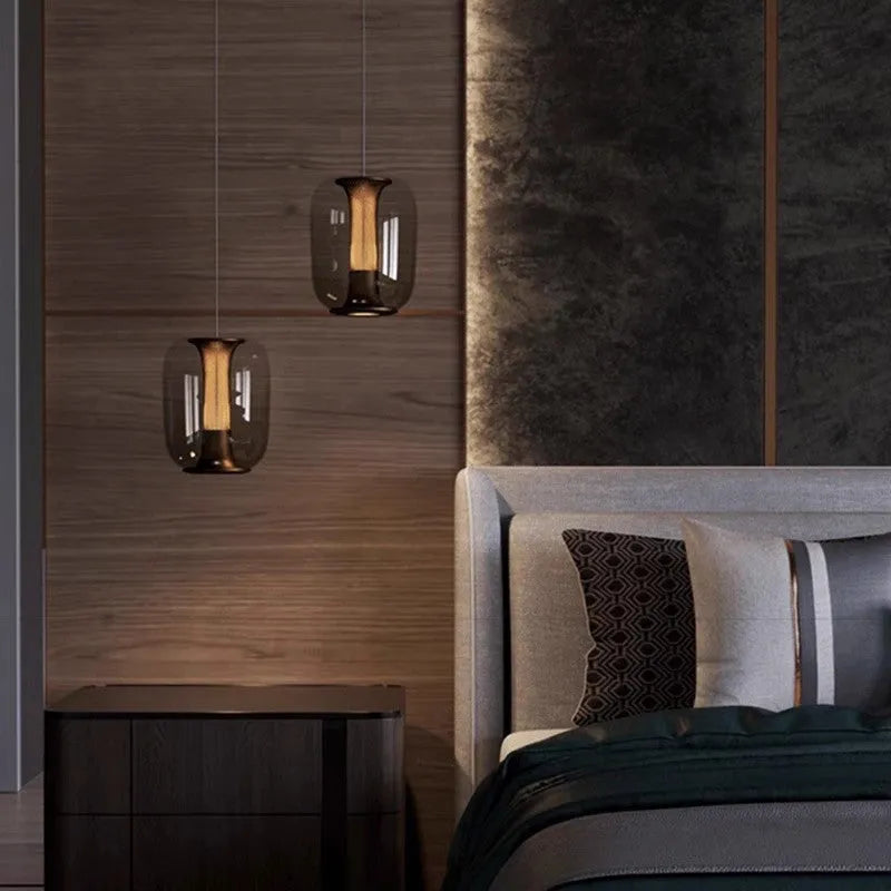 Minimalist Nordic pendant light with a spherical glass globe shade in smoky grey colour.