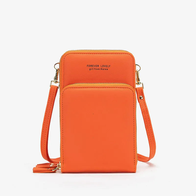 Green crossbody bag with tri-fold pockets and zipper closure on white background