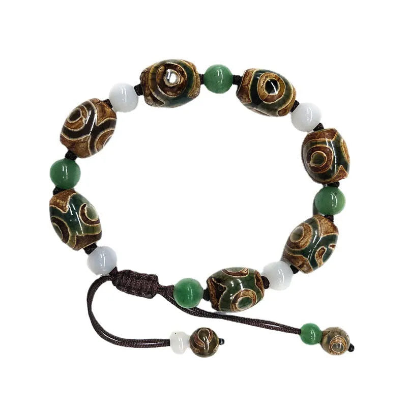 Green agate ethnic bracelet with three eye Tibet beads in hand-woven geometric pattern
