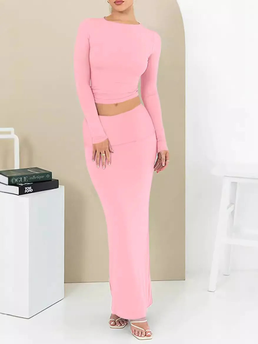 Women's black crop top and long skirt two-piece set with three-quarter sleeves and exposed navel design
