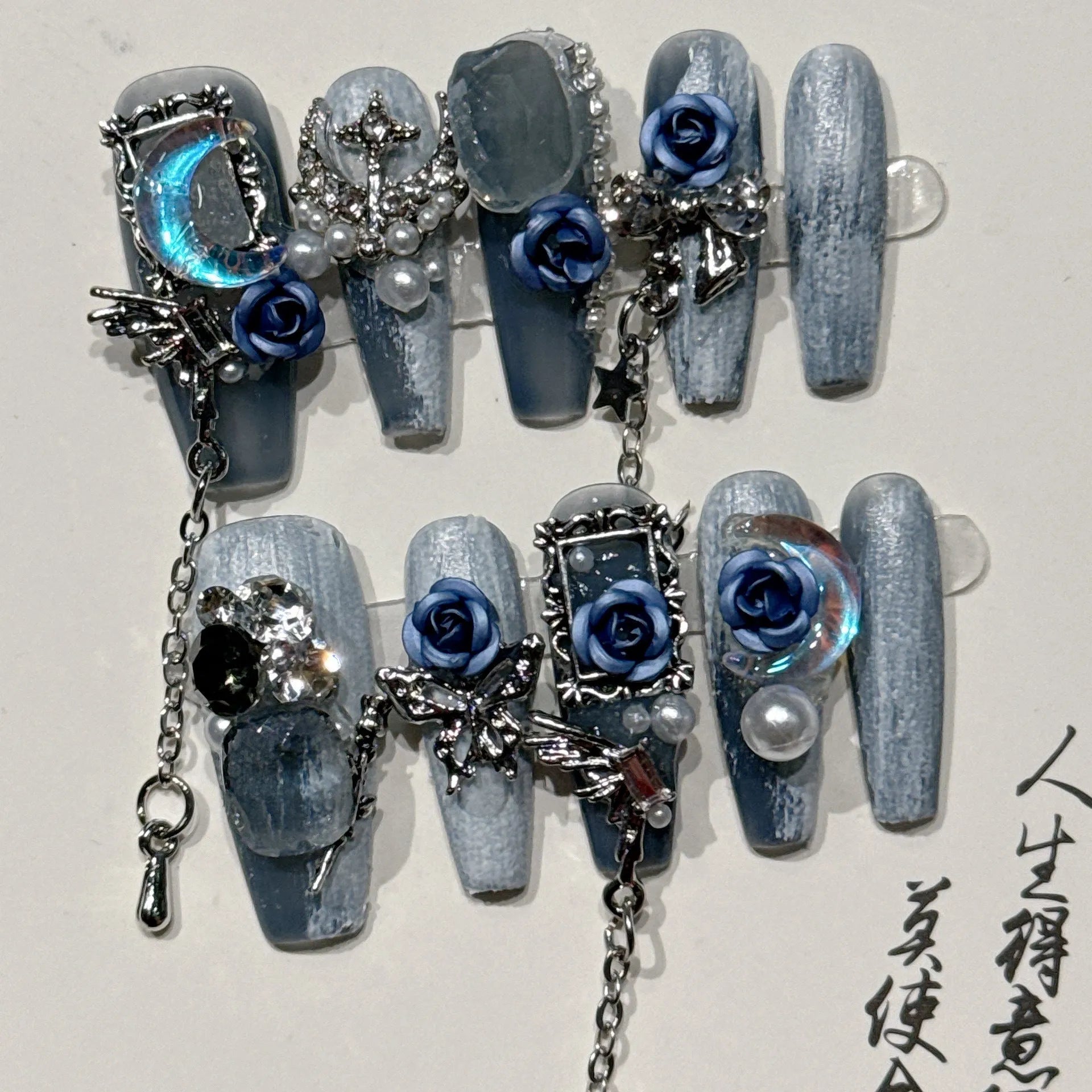Evening manicure set with ornate rose pattern in heavy industry night blue colour