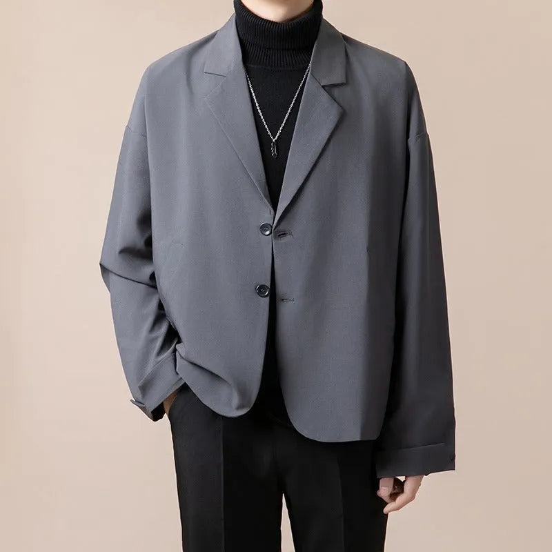 Men's loose fit casual suit jacket in apricot colour on a hanger.