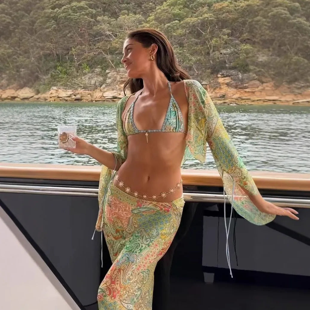 Halterneck printed lace-up split swimsuit with long bell sleeves in green, front view