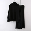 Women's beige acrylic sweater and wide-leg trousers two-piece set laid flat.