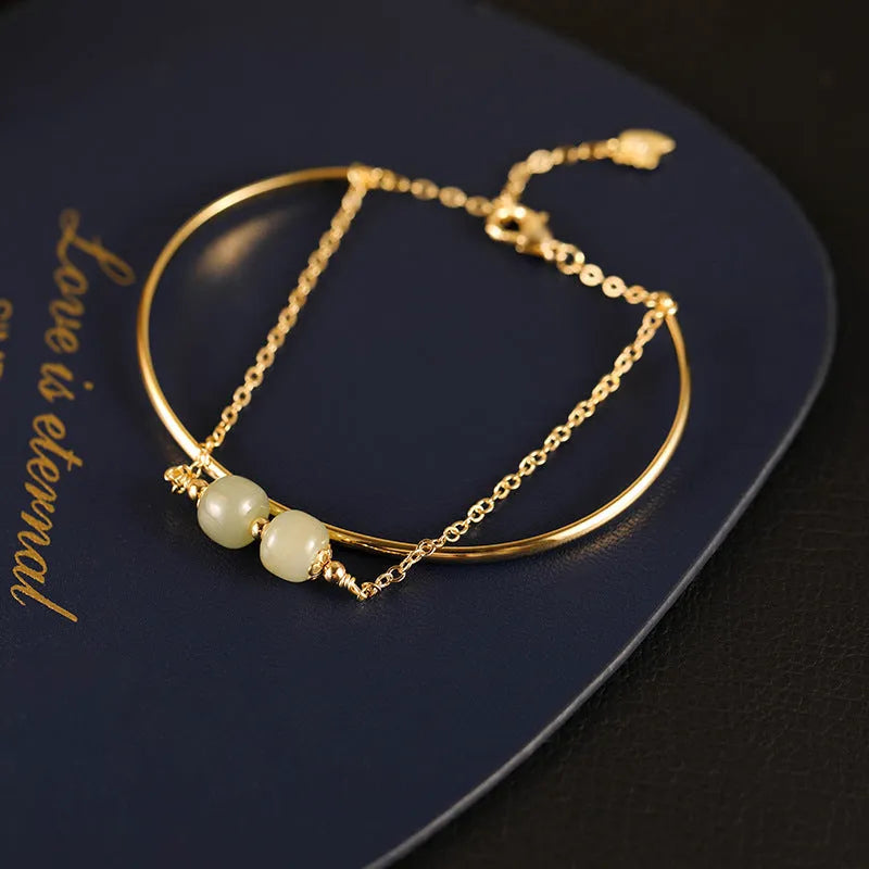Hetian jade lucky beads bracelet with gold inlay treatment in single, double, or three beads version