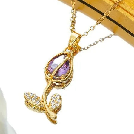 Zircon Tulip necklace with gold floral pendant on an adjustable titanium steel O-ring chain.