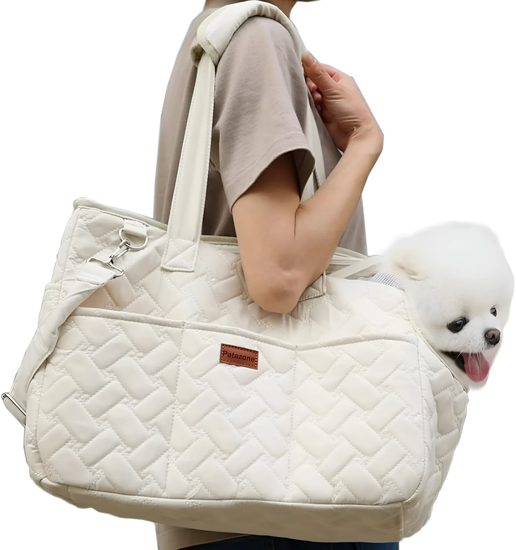 Grey pet carrier handbag with mesh panels and multiple pockets, shown with a small dog inside.