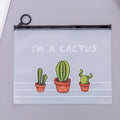 Clear PVC pencil case with cactus print, sealed closure, 17.1 x 21.2 cm, containing pens and pencils