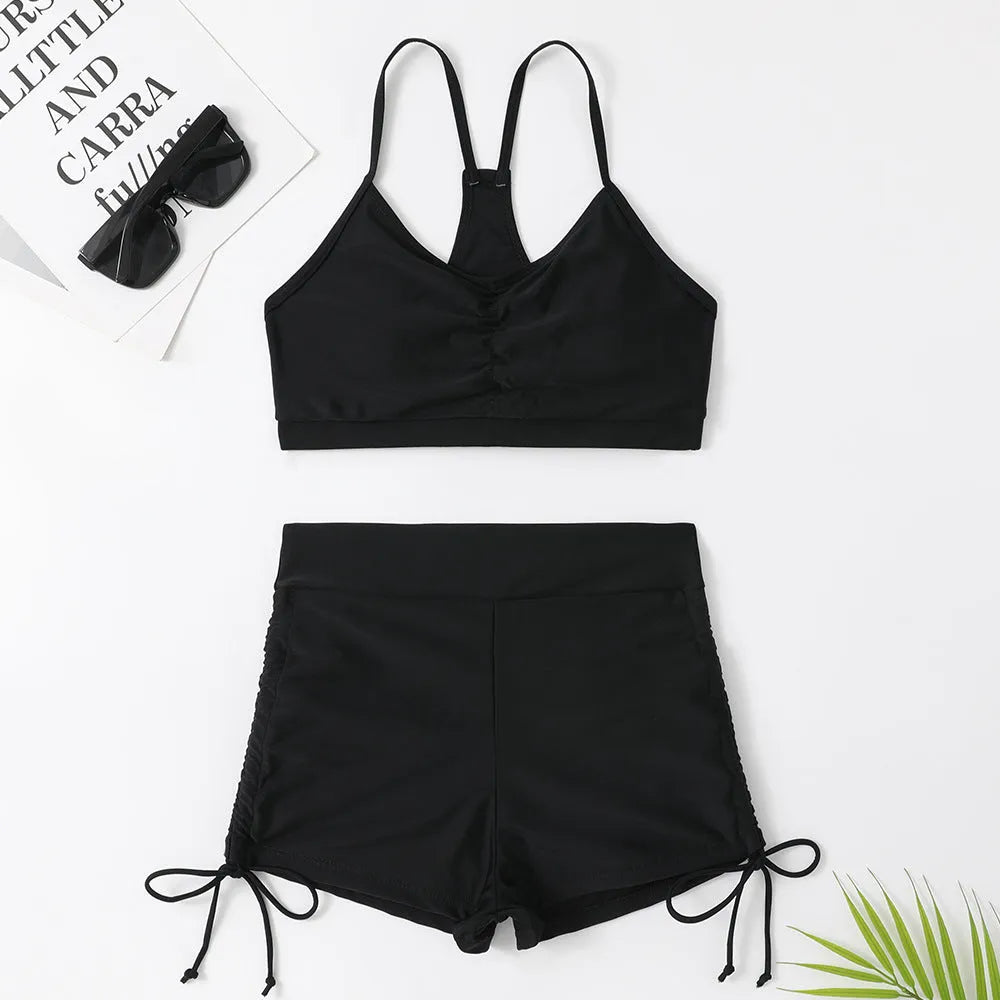 A purple high-waist split swimsuit for women, showing the bikini briefs style and sleeveless design.