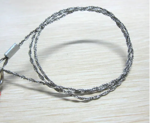 Stainless steel survival wire saw with pull rings showing 55cm cutting blade and extended 70cm total length