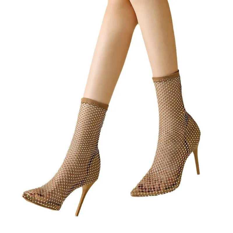 Gold high heel sandals with pointed stiletto heels and mesh upper