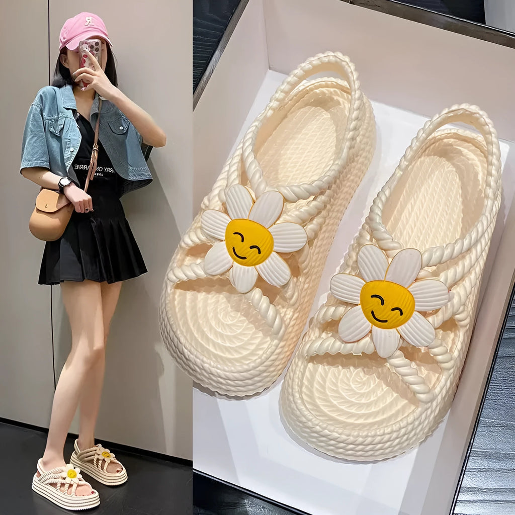Women's PVC sandals with floral decorations and round toe design in beige colour