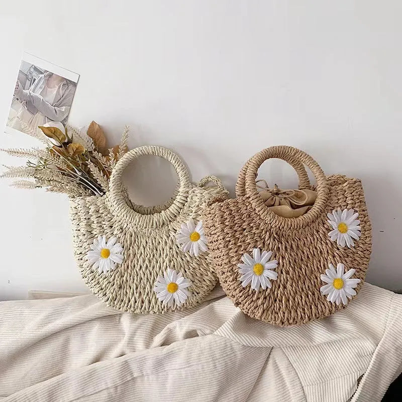 Women's woven straw crossbody bag with daisy pattern in light brown colour