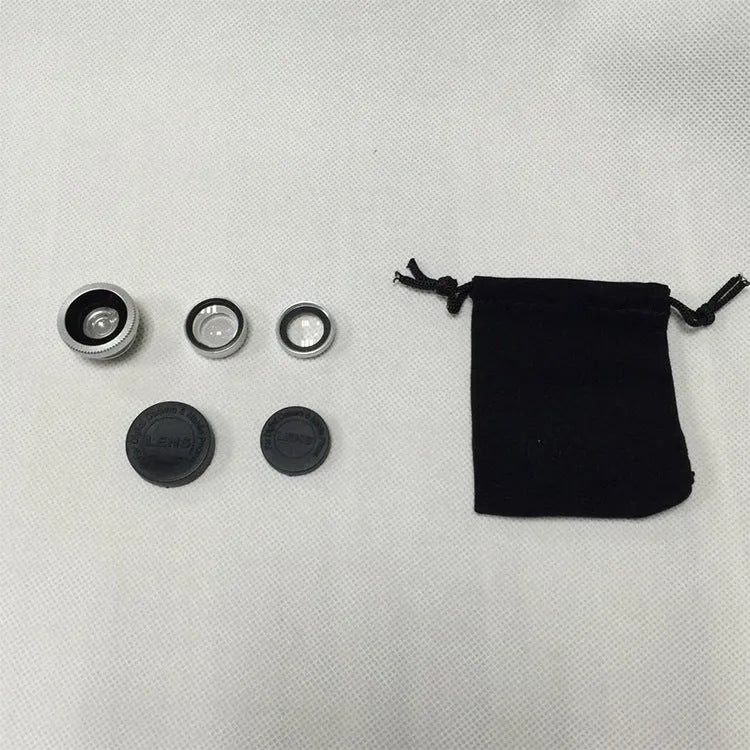 Three smartphone clip-on lenses: fisheye, wide-angle, and macro, in assorted colours on a table