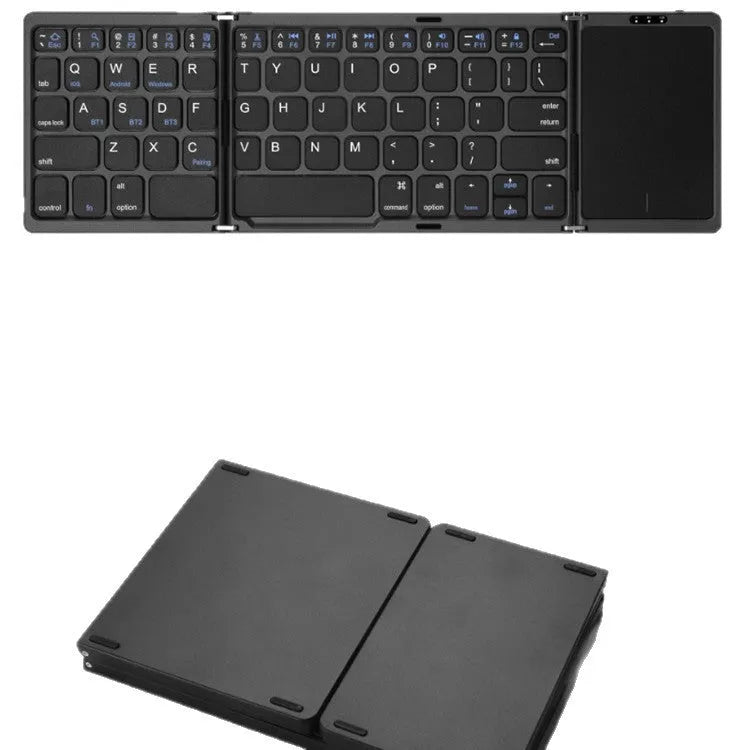 Three folding wireless Bluetooth keyboard with touch pad in black, unfolded on a table