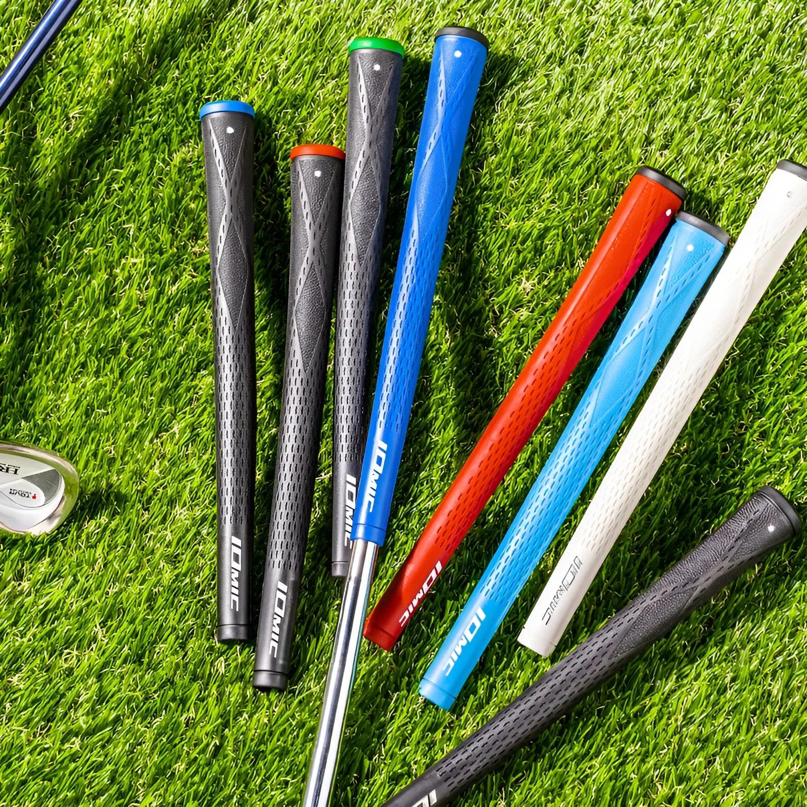 TPE material golf club grip in various colours including pink, red, blue, white, and black with coloured heads.
