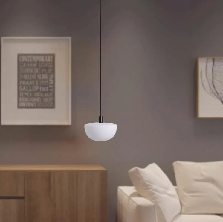 Simple modern glass pendant light with single-head droplight design in milky white finish