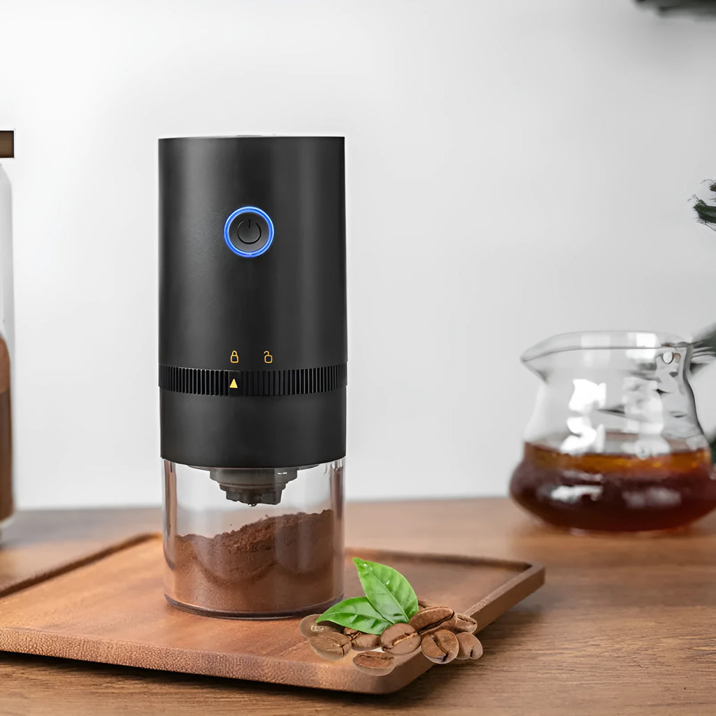 Portable black electric coffee grinder with transparent chamber and USB-C charging cable