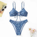 Blue women's swimsuit set with matching top and shorts on a white background.