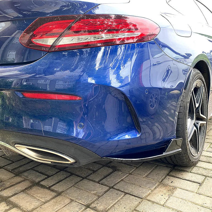 PP plastic car rear corner protectors in piano black and carbon fibre pattern finishes shown as a left and right set