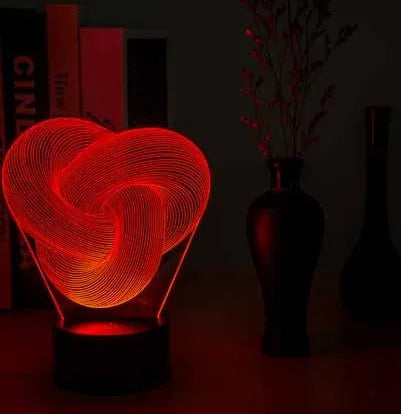 Twist abstract LED 3D night light in colour gradient mode on a wooden table with remote control