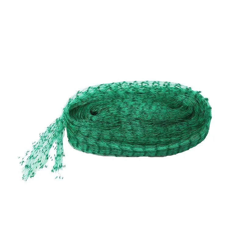 Green PP anti-bird netting draped over garden plants for fruit and vegetable protection