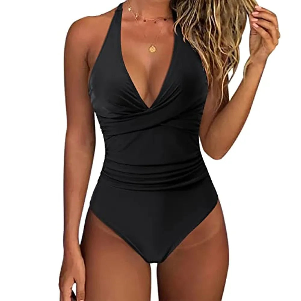 Women's solid colour one-piece swimsuit with cross-back straps on a mannequin.