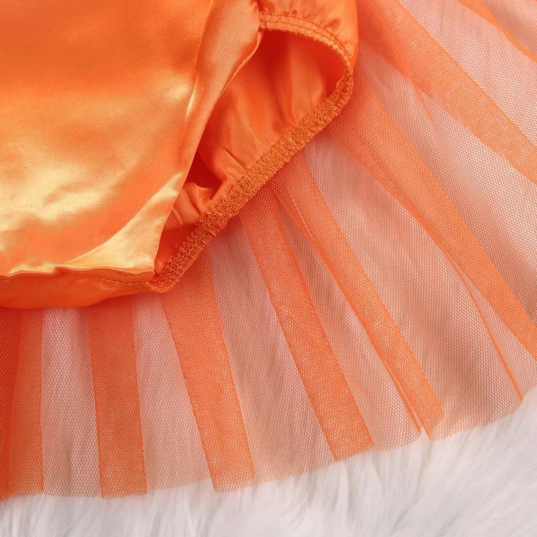 Children's orange Halloween gauze jumpsuit with cartoon dot pattern and voluminous pleated skirt on a white background