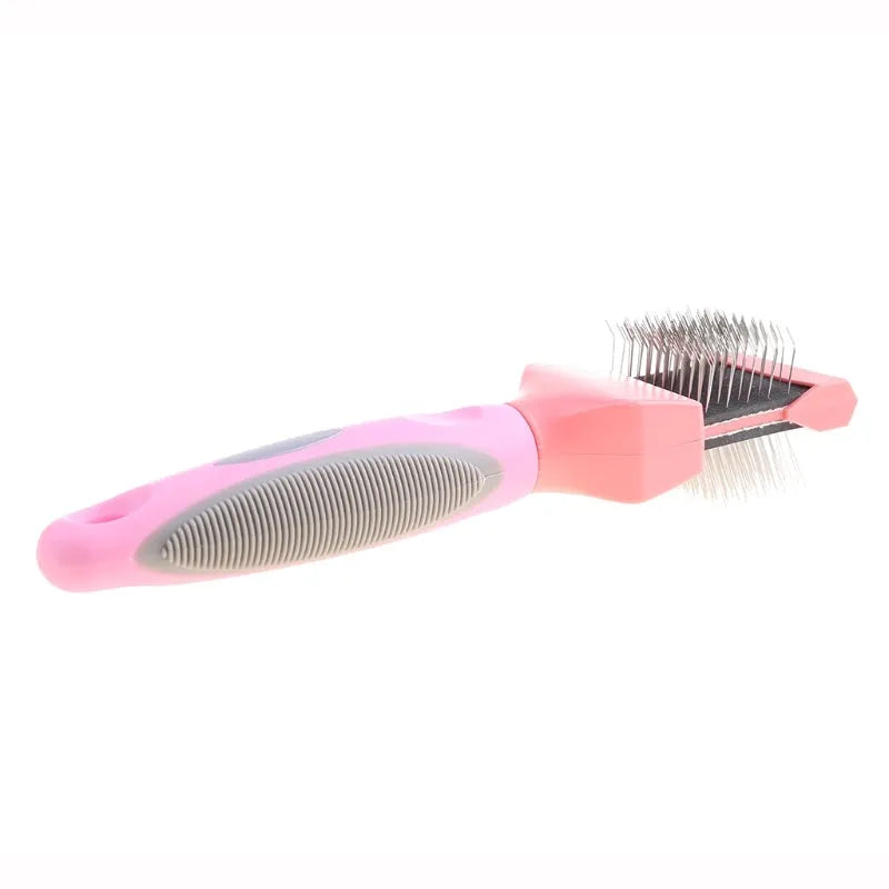 Blue dual-sided pet grooming brush with stainless steel pins on a wooden table.