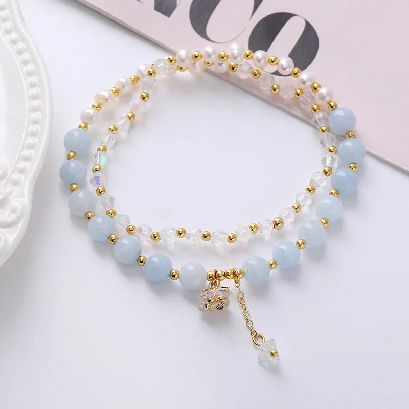 Women's double ring crystal bracelet in choice of strawberry quartz, amethyst, or aquamarine colour